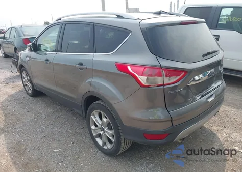 2014 Ford Escape Titanium z USA, uszkodzony, nr VIN 1FMCU0JX4EUE36925